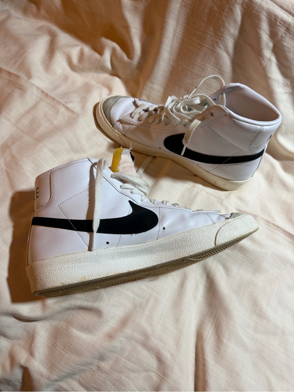 Nike White High-Top Sneakers with Black Swoosh